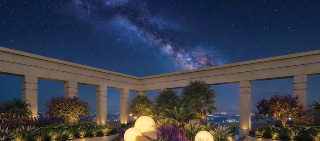 Brigade Barcelona rooftop sky deck at night — colonnade, planted mounds and glowing orb lights